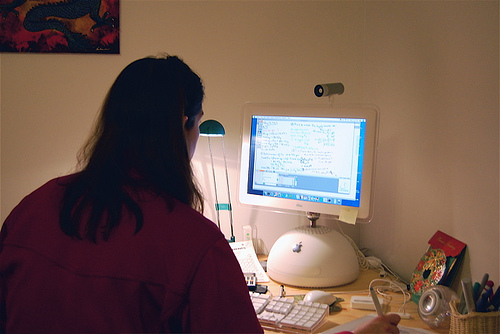 Online tutor at computer
